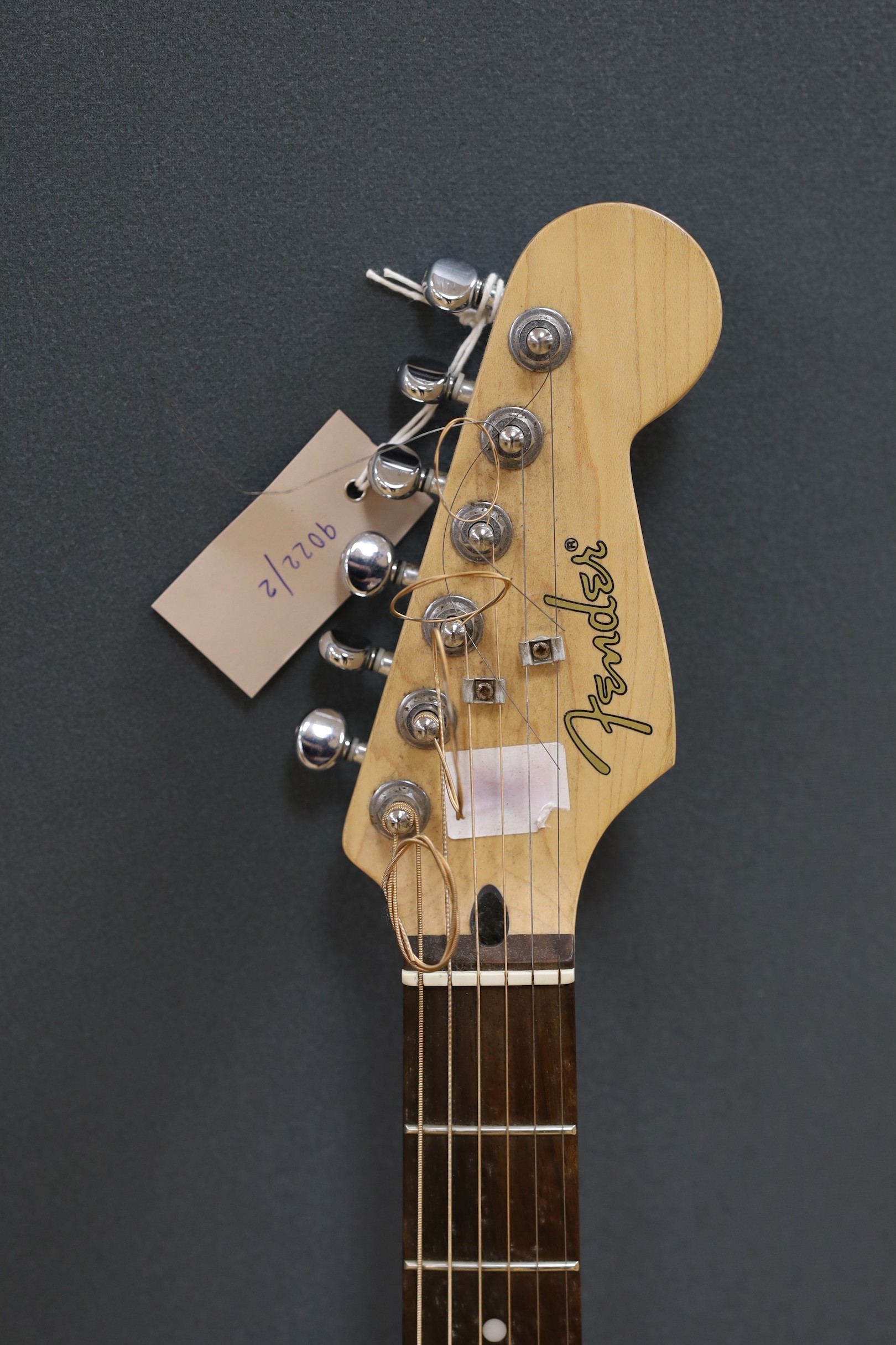 A Fender Stratacoustic electric guitar, serial no. CD04122687